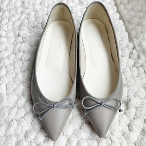 Soft leather grey pointy toe flat with bow